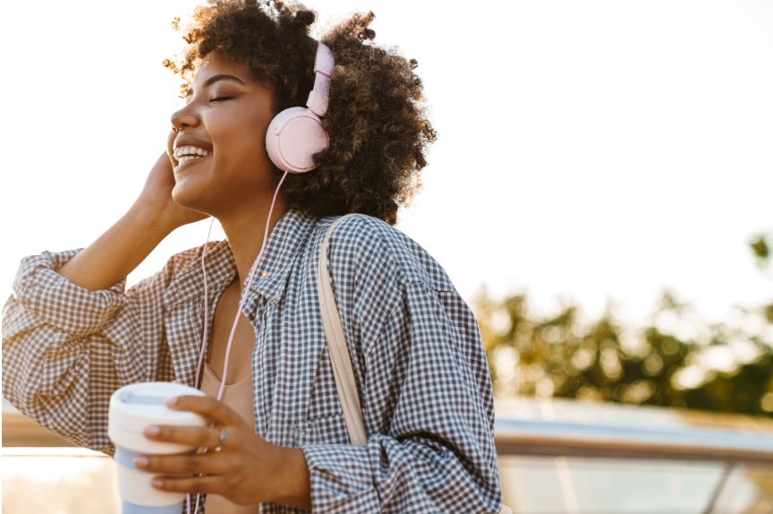 Woman peacefully listening to headphones
